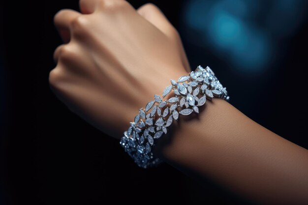 Close-up of a diamond leaf-pattern bracelet on a woman's wrist against a dark background.